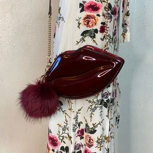 Women's Burgundy Chevez Lips Patent Clutch Bag.